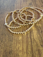 Load image into Gallery viewer, Gold Beaded Bracelet w/ Cross - SET of 5
