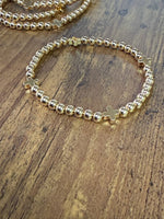 Load image into Gallery viewer, Gold Beaded Bracelet w/ Cross - SET of 5
