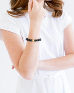 Load image into Gallery viewer, Black Onyx Stretch Bracelet &amp; Gold Bead
