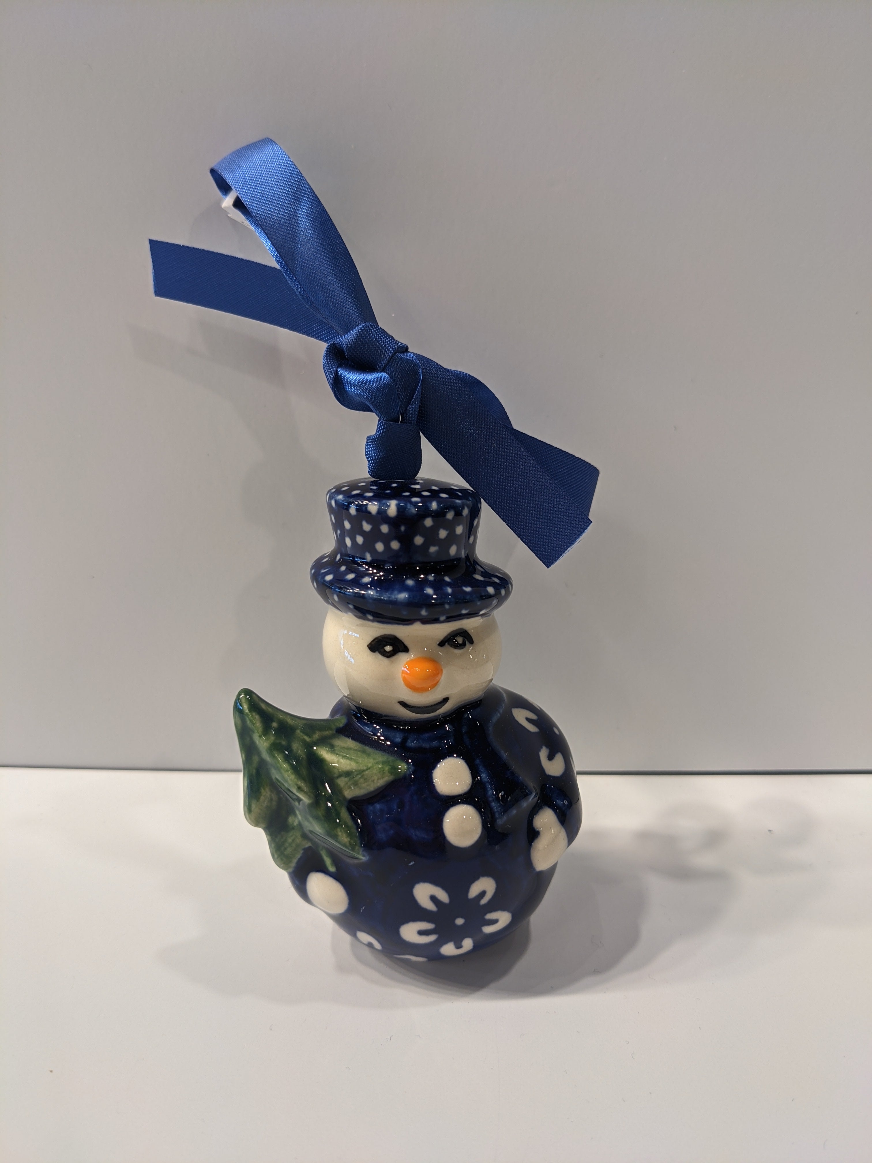 Snowman Holding Tree Ornament Blue Blossom